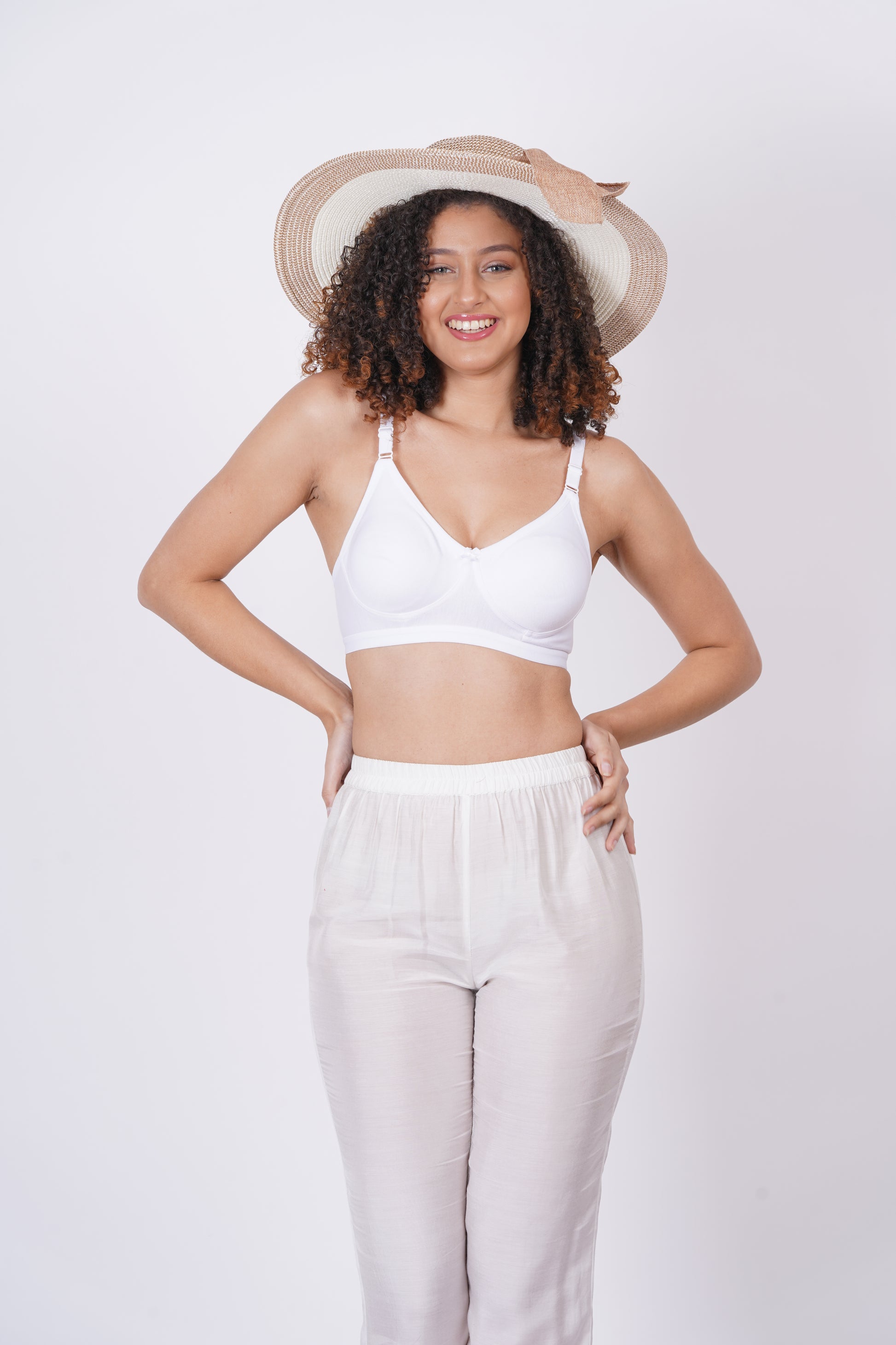 White Seamless lingerie with a pull-on closure, cup D bra size, and adjustable bra strap, designed for both comfort and style.