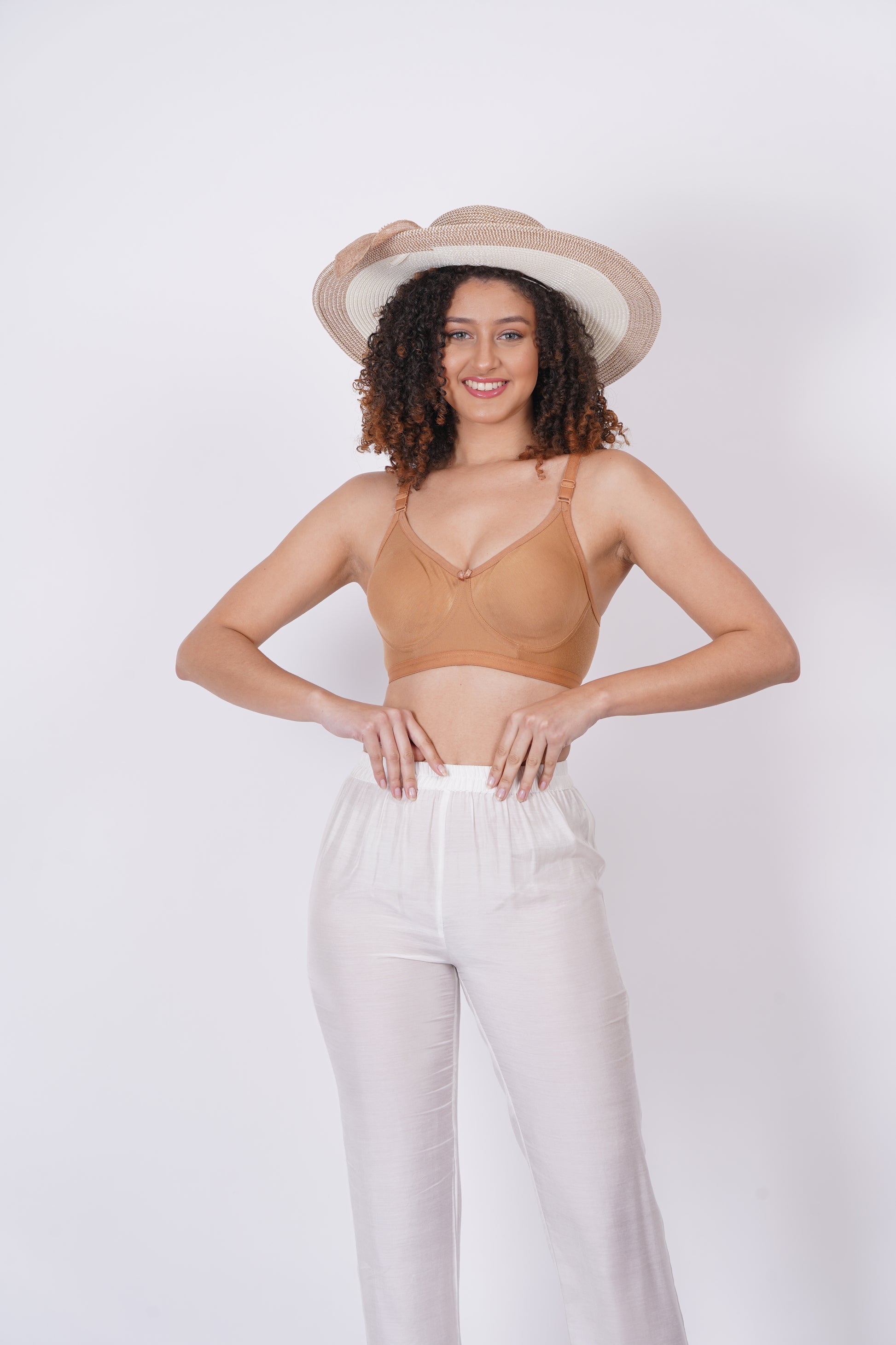 Women bra with molded cups, seamless construction, and a pull-on closure, delivering a sleek, no-show effect under clothing.