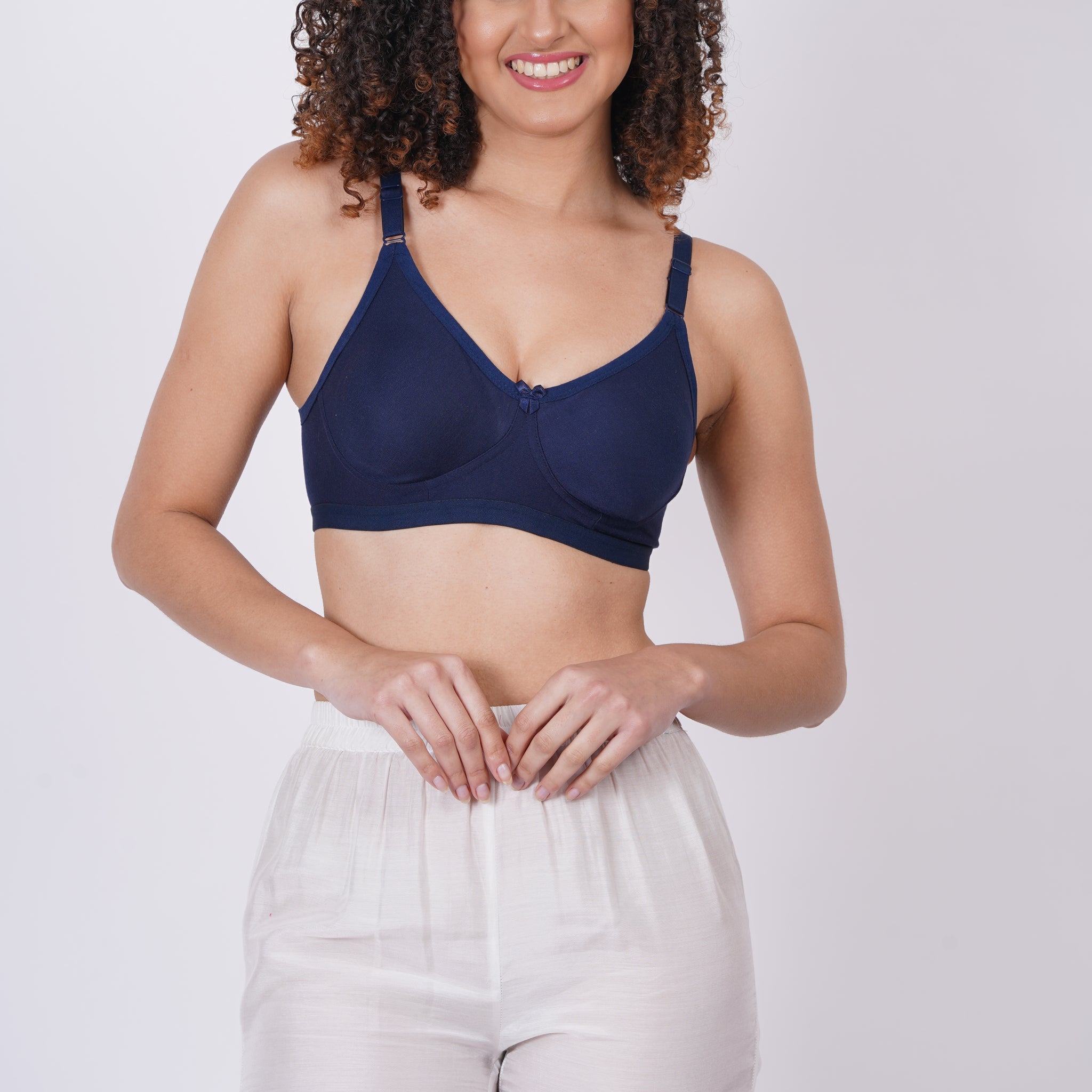 Cup C bra size with molded cups and a pull-on closure, crafted from soft nylon fabric for a seamless, body-hugging fit and wireless comfort.