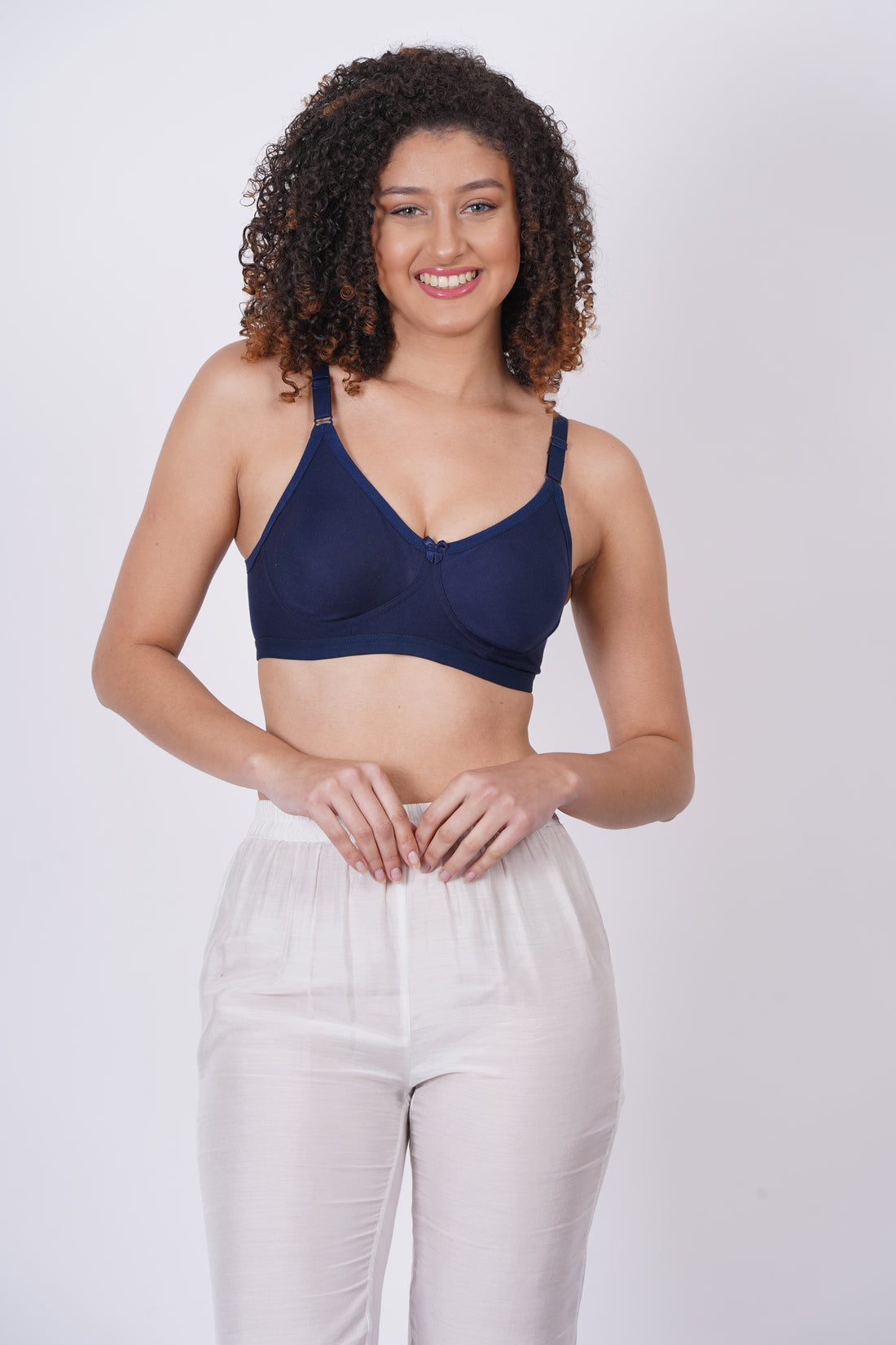 Cup C bra size with molded cups and a pull-on closure, crafted from soft nylon fabric for a seamless, body-hugging fit and wireless comfort.