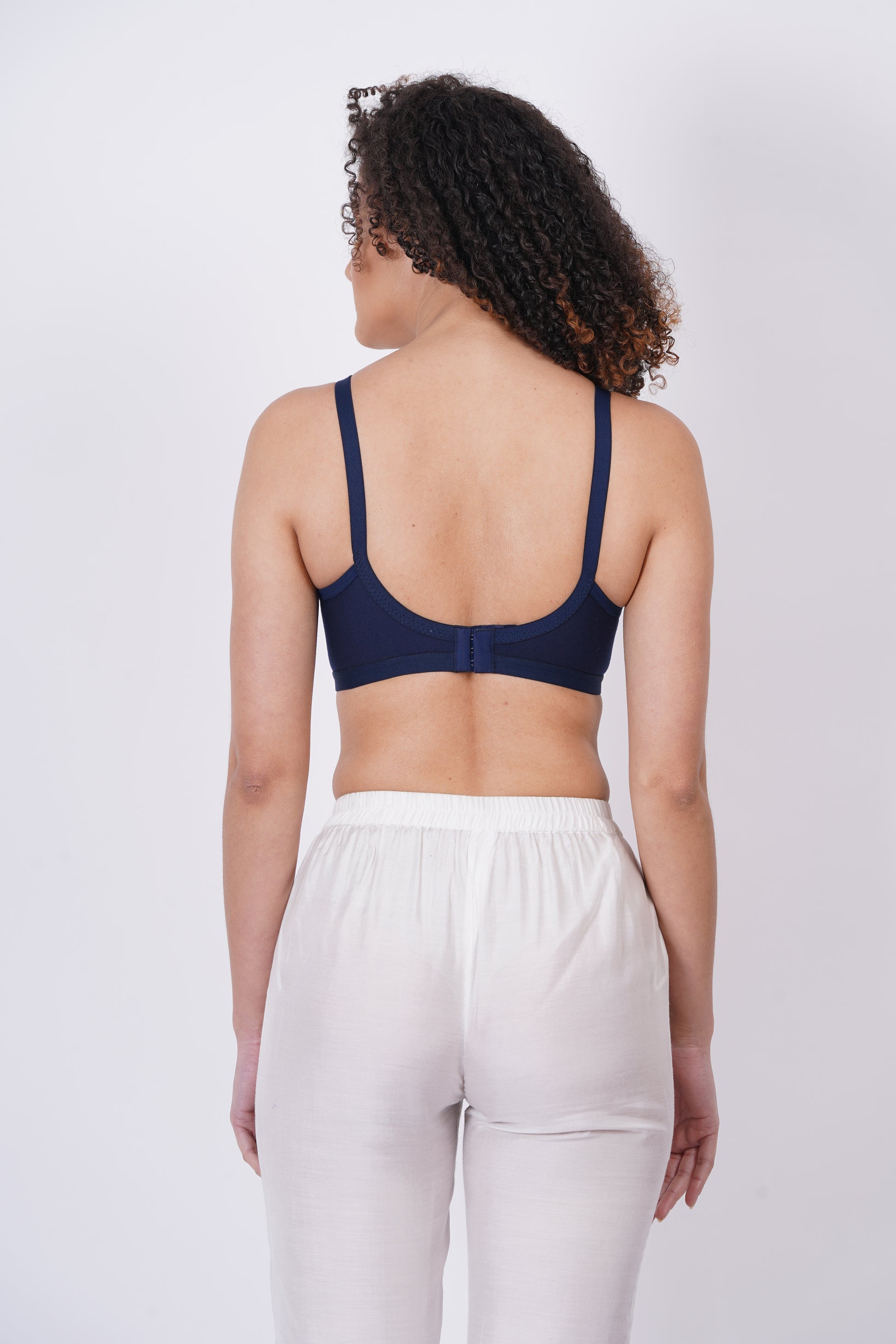 Figure bra with pull-on closure and adjustable straps, offering a perfect blend of support and seamless coverage for a smooth silhouette.

