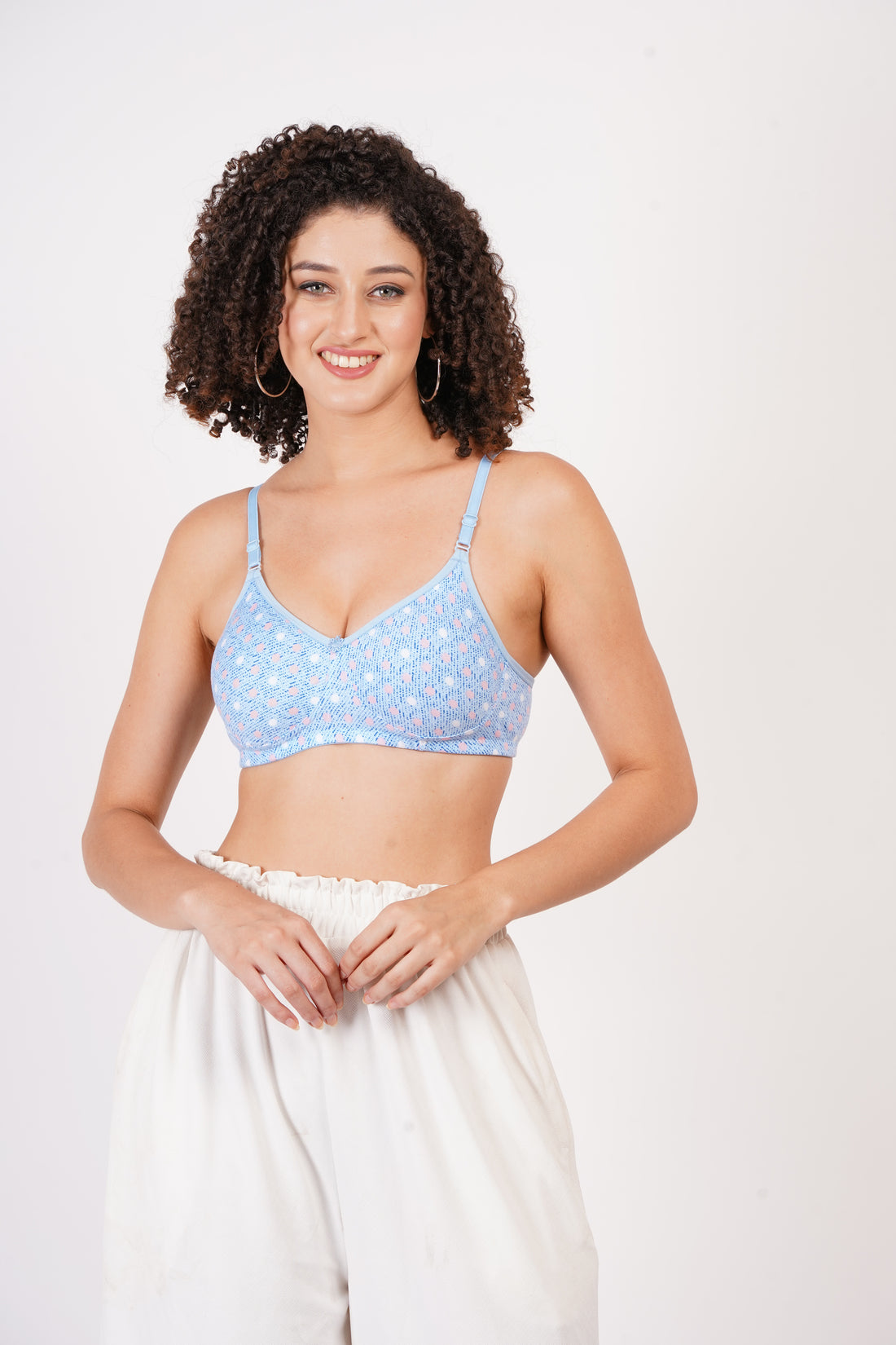 Cup B bra size with seamless molded cups and wire-free comfort. A stylish printed bra offering minimal bra coverage for a natural fit.