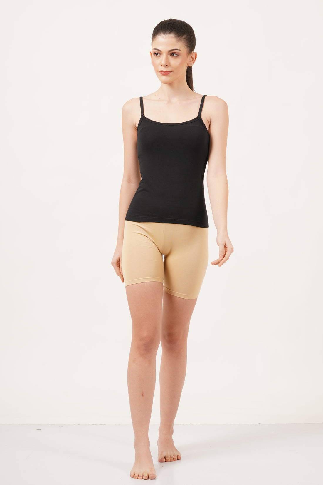 Shop black Camisole for women with a U-neck design, offering a sleek and flattering figure fit.
