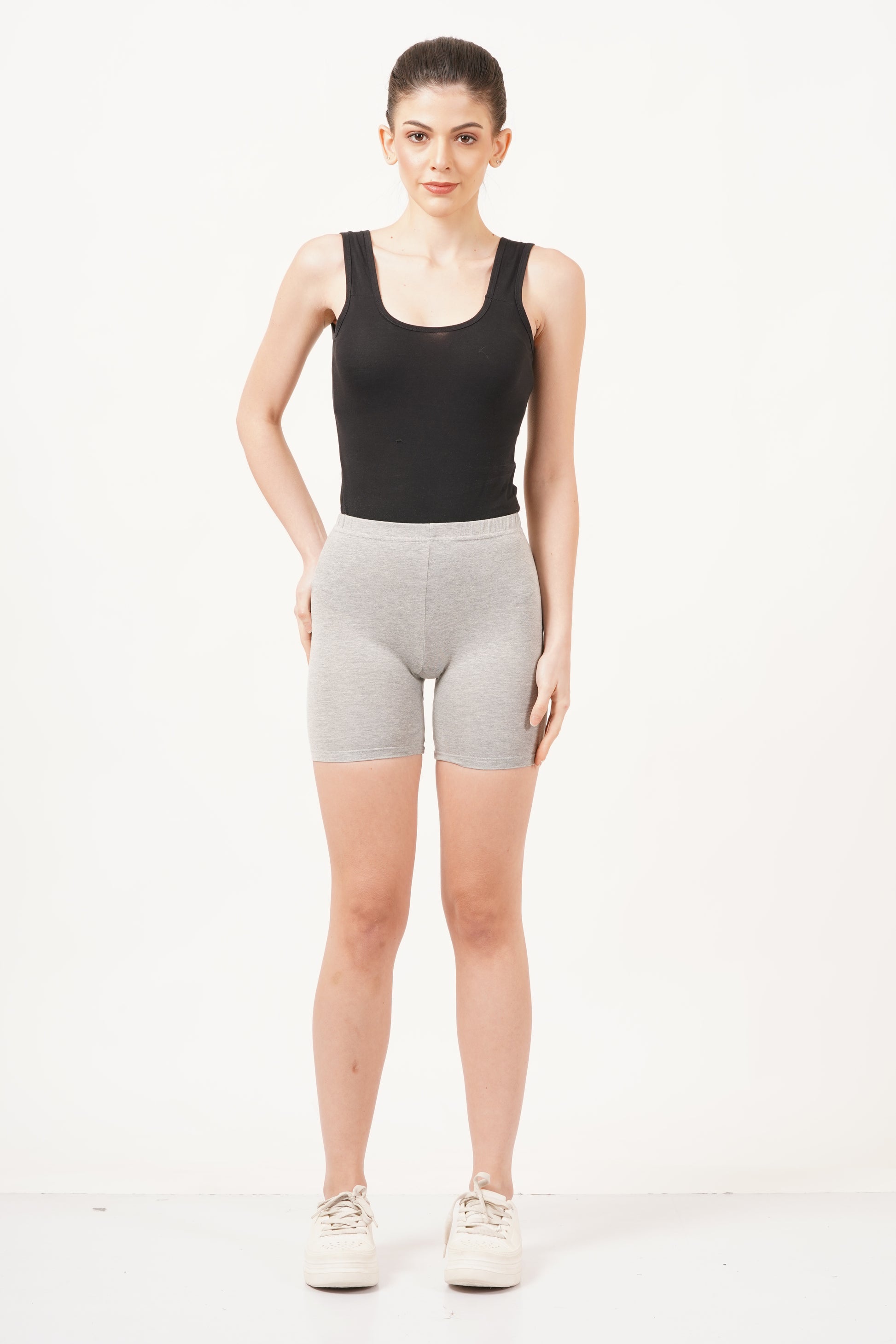 Mid-waist rise bicycle shorts designed to provide a snug yet flexible fit for active movement.
