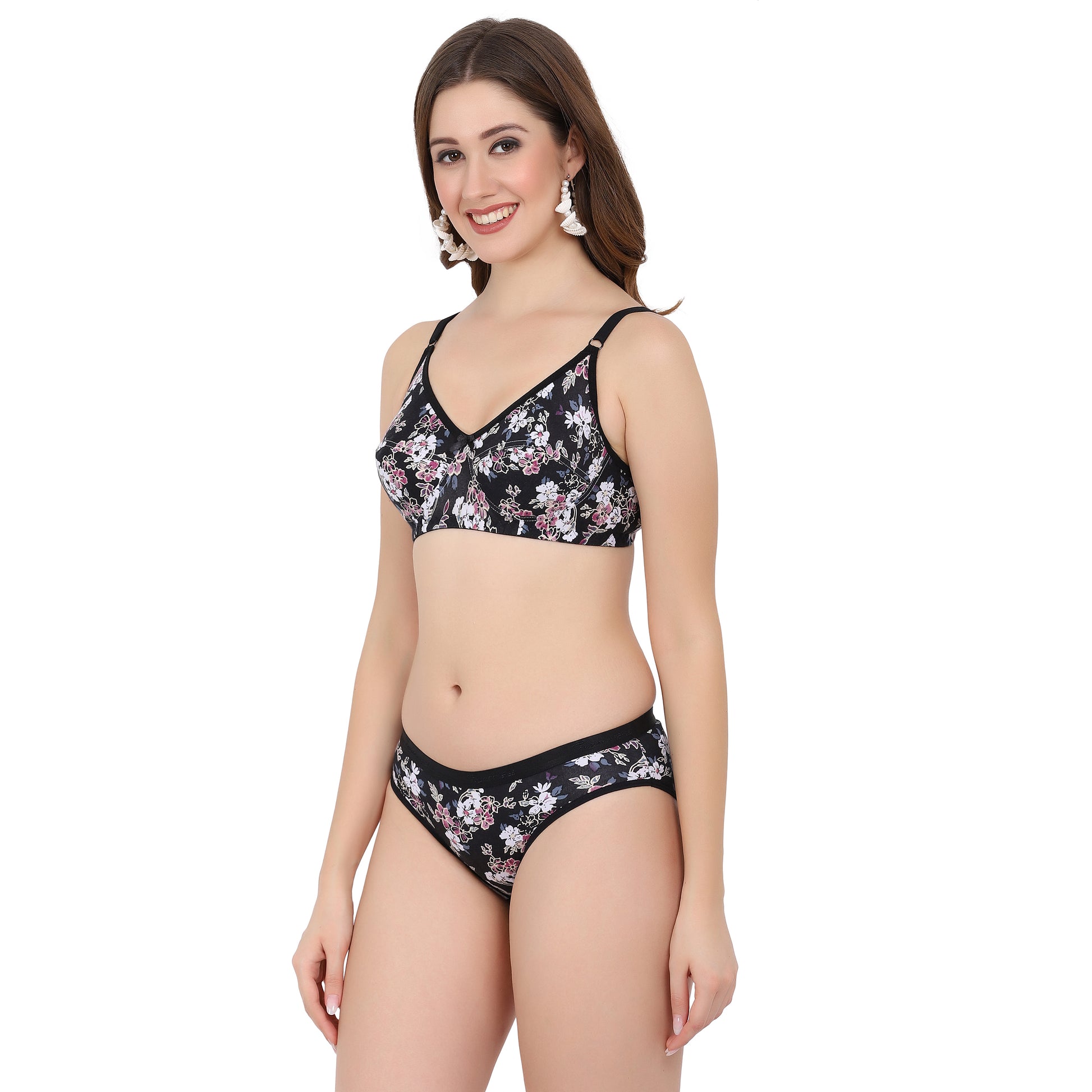 Floral prints adorn this black printed bra and panty set, full coverage  perfect choice for a romantic honeymoon.