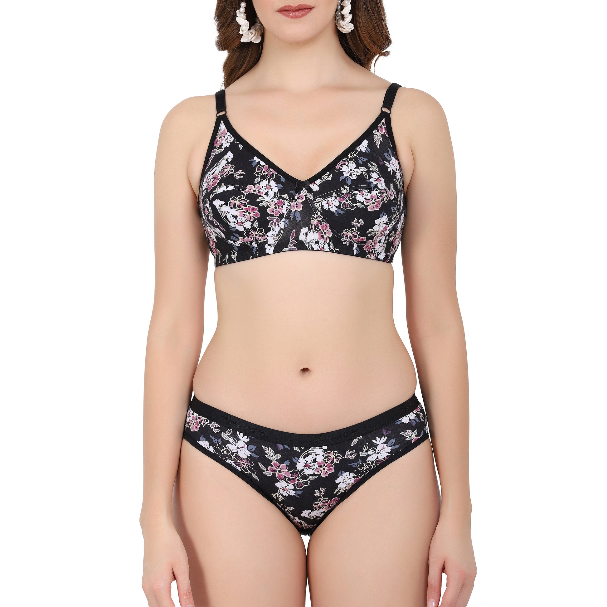 Buy bridal sets lingerie featuring a black printed bra and matching panties with floral designs for a chic honeymoon look.