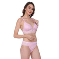 Pink bra and panties matching set adorned with lace, designed for comfort and to enhance the natural curves of the body.
